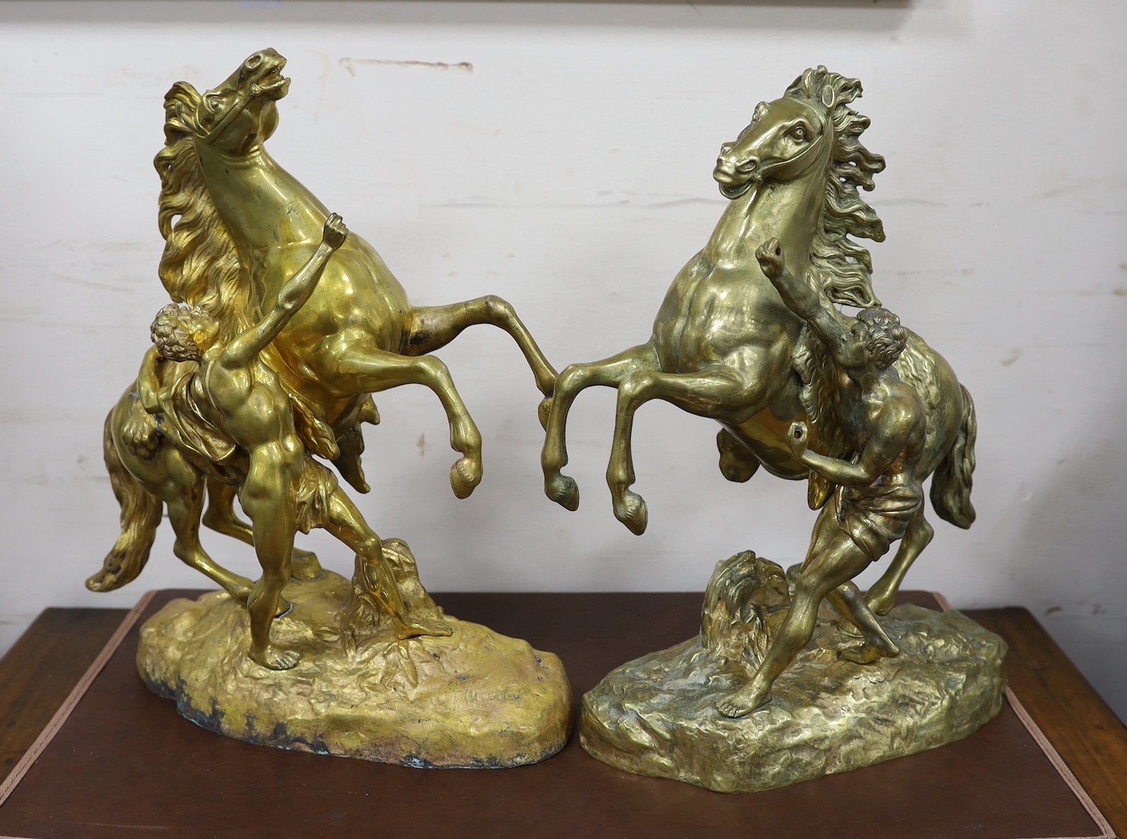 A pair of bronze Marly horses after Cousteau, 40cm high